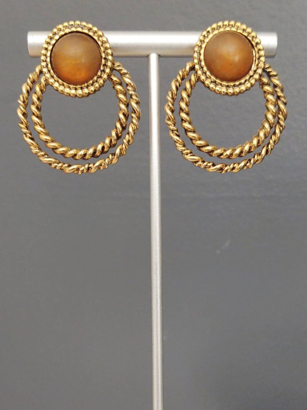 Textured gold door knocker earrings with brown center bead